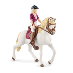 Blondína Sofia s pohyblivými kĺbmi na koni